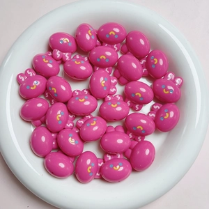 Close-up of pink 20mm acrylic cherry rabbit beads for DIY jewelry and phone chain making