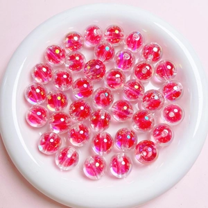Macro shot of 16mm pink UV transparent sugar heart beads for DIY jewelry making