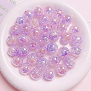 Close-up of 16mm purple crackle beads with UV gradient and glitter for DIY jewelry making