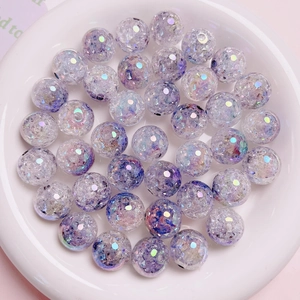 Macro detail of 16mm purple UV gradient crackle beads for jewelry and DIY crafts