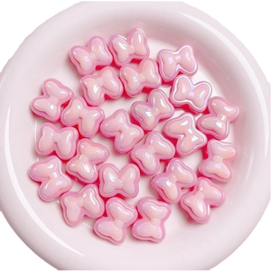 Pastel pink bow beads with pearlescent finish for DIY jewelry and phone chain making