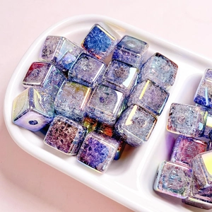 Macro detail of cube acrylic beads with blue-purple gradient and cracked ice texture