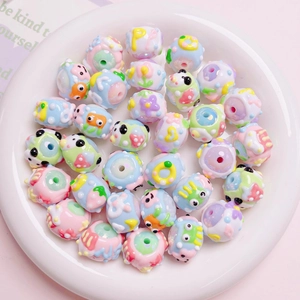DIY colorful acrylic macaron beads with 3D cartoon patterns in a white display dish