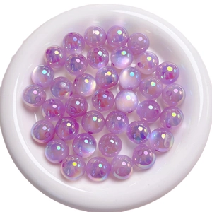 Polished purple AB color acrylic cat eye round beads for DIY jewelry making in a white tray