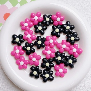 Macro detail of 20mm flower acrylic beads for DIY jewelry and phone chain making