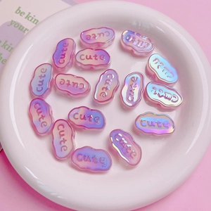 Macro shot of cute cloud-shaped iridescent acrylic beads for DIY jewelry making and crafts