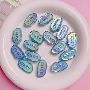 Irregular cloud-shaped acrylic beads with cute lettering and iridescent blue-green glow