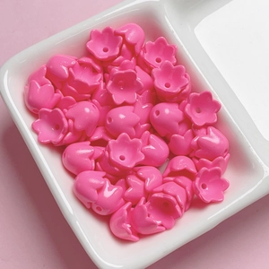 Macro detail of pink lily of the valley acrylic flower beads for DIY jewelry making