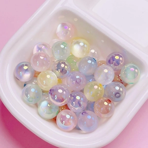 Macro detail of glossy aurora UV coated acrylic cat-eye beads for DIY jewelry making