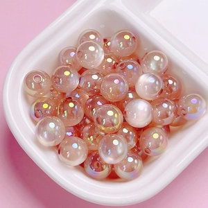 Pastel pink acrylic cat eye beads with rainbow UV coating for DIY jewelry making
