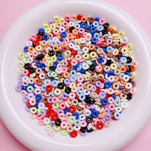 Macro detail of colorful mixed alloy donut spacer beads for DIY jewelry making and crafts