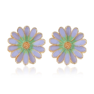 Detailed close-up of daisy studs featuring purple gradient enamel and golden core texture