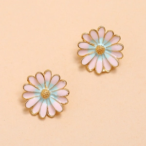 Detail of gradient blue and pink enamel daisy earrings with elegant gold plating finish