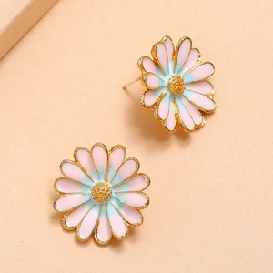 Detailed macro view of enamel daisy earrings featuring pink and blue petals with gold trim