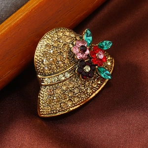 Elegant gold hat-shaped brooch with amber crystals and floral rhinestones for women