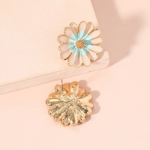 Minimalist daisy stud earrings in gold with white and light blue enamel floral petals