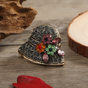 Vintage gold heart brooch with colorful rhinestones and floral crystal pattern