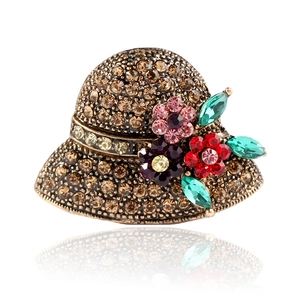 Vintage gold hat brooch with sparkling champagne rhinestones and colorful floral accents