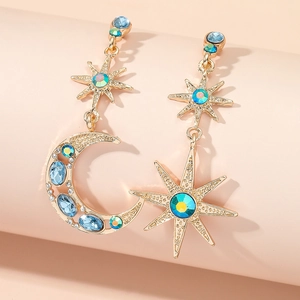 Elegant asymmetric gold star and crescent moon earrings with blue and green crystals