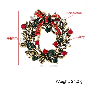 Elegant Christmas wreath brooch with red and green rhinestones on gold alloy base