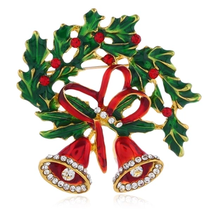 Christmas bell brooch with green holly leaves and red enamel bow in gold alloy