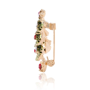 Side view of golden Christmas tree brooch with colorful rhinestones and secure clasp