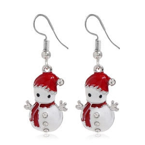 Close-up of cute snowman earrings with red enamel hats and sparkling crystal accents