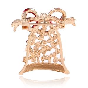 Detailed back view of Christmas bell brooch showing pin clasp and hollow metalwork