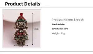 Detail view of a vintage Christmas girl brooch with red and green rhinestones and dimensions