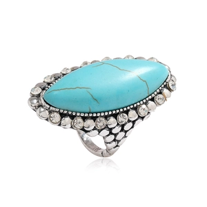 Vintage bohemian wide band ring featuring a turquoise stone with rhinestone accents