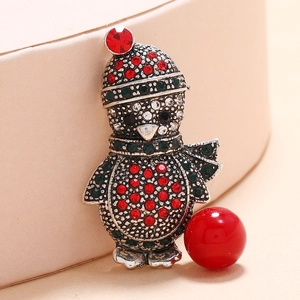 Sparkling penguin Christmas brooch with colorful rhinestones and red pearl detail