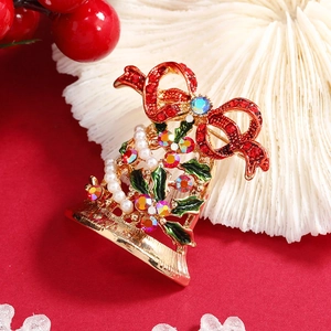 Golden Christmas bell brooch with red bow green enamel holly leaves and pearls