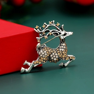 Élégante broche renne avec cristaux ambrés sur métal argenté pour les fêtes de Noël