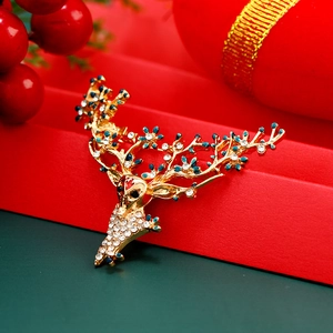 Broche de renne de Noël luxueuse avec fleurs en émail bleu et strass scintillants