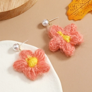 Handcrafted crochet flower earrings with white pearls and warm autumn color tones