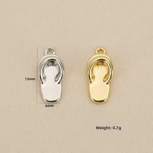 Detail view of 18k gold and silver flip-flop charms with 13mm size specifications
