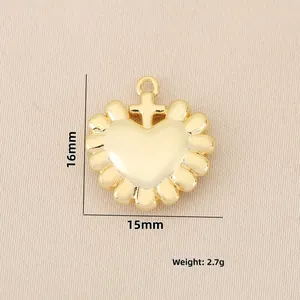 Macro detail of 18k gold plated heart pendant with cross link and size dimensions