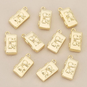 Detailed view of 18k gold plated rectangular bow charms for handmade jewelry making