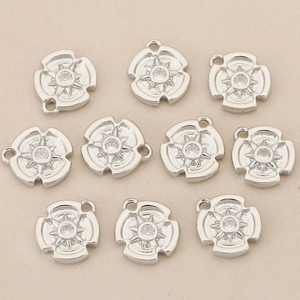Set of 10 round 18k gold plated starburst charms with sparkling zircon center stone
