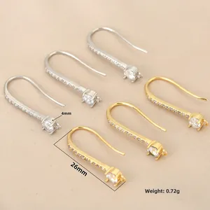 Detailed view of U-shaped 18k gold plated ear hooks with pavé cubic zirconia and hanging loop