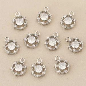 Macro view of ten round zircon pendants with 18k gold plating for DIY jewelry