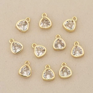 Macro shot of 18k gold plated triangle crystal pendants for DIY jewelry making