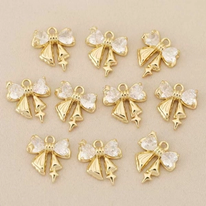 Set de 10 colgantes de lazo dorados con cristales y dijes de estrellas con cascabeles