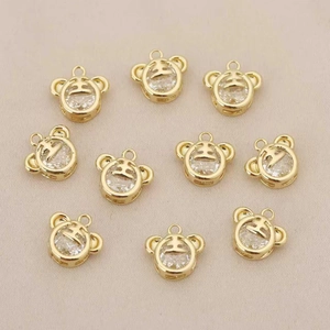 Detail of ten 18k gold plated tiger head pendants with sparkling zircon stone settings