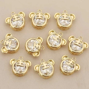Set of 10 gold plated tiger head charms with sparkling zircon and traditional king mark