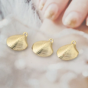 Three golden shell charms for DIY jewelry making with wave texture and top hanging loops