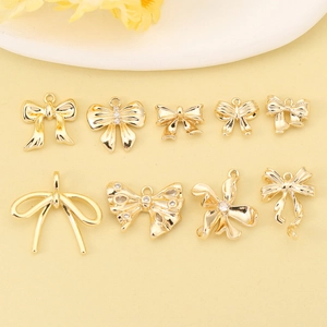 Selection of 18k gold plated bow charms for DIY jewelry making and earring design