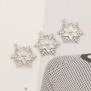 Three silver snowflake jewelry pendants with zirconia stones for DIY crafting necklaces