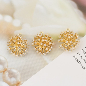Three gold flower pendants with micro-set zircon crystals and elegant radial design