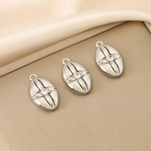 Retro 18K gold plated oval pendant with relief cross and sparkling cubic zirconia stone